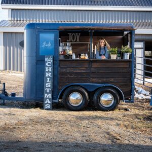 Eido Bar Company's bar trailer with Business Owner Rochelle Albert inside