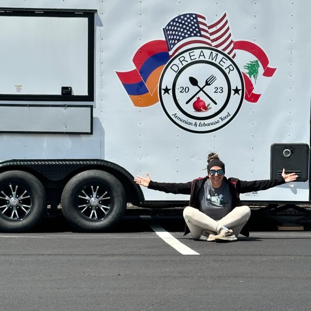 Business Owner Anik Derphilibossian sitting in front of her food truck Dreamer Food