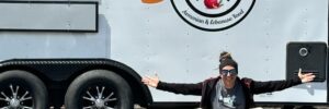 Business Owner Anik Derphilibossian sitting in front of her food truck Dreamer Food