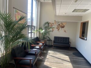 Waiting room at Gillies Law in Portland with maps, chairs and plants